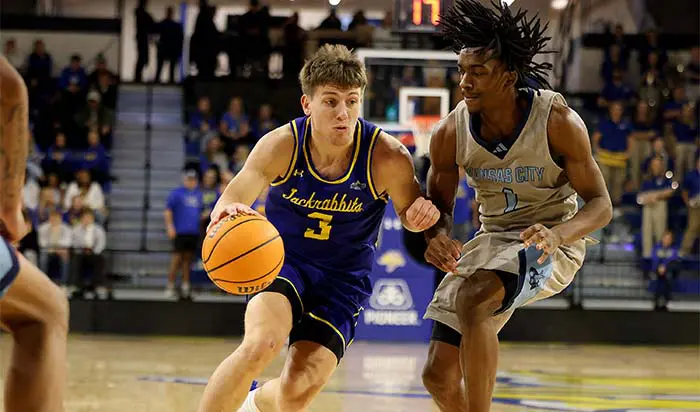 Basketball player mid shot